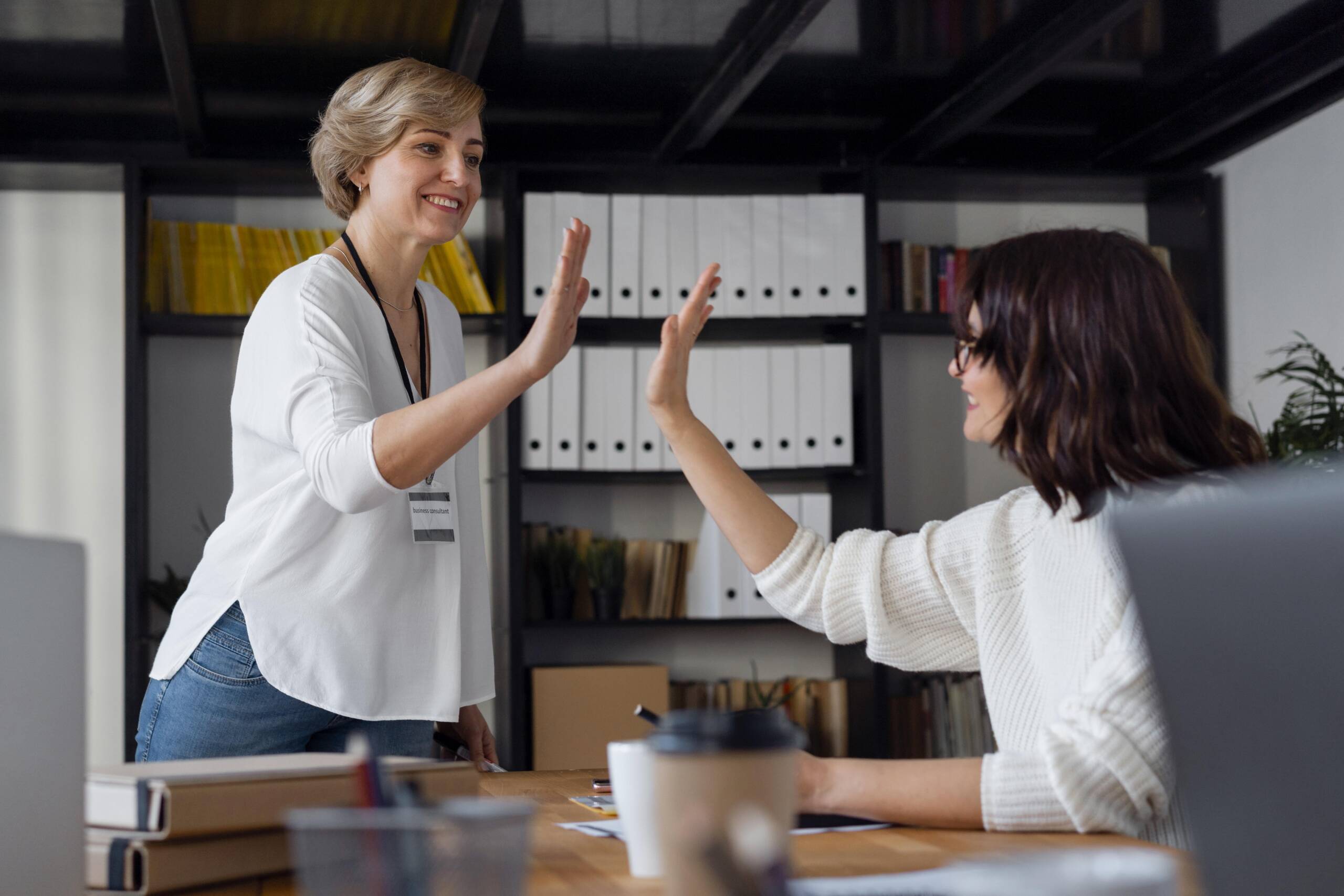 medium-shot-business-women-high-five highfive